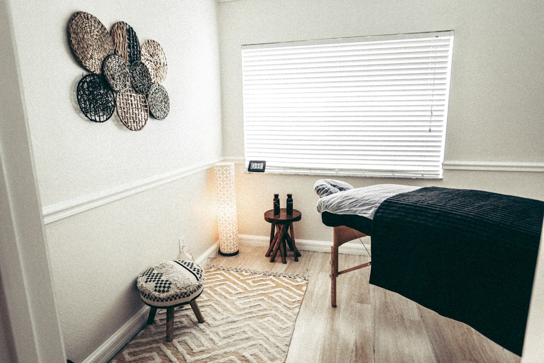 Calm private treatment room with a treatment table